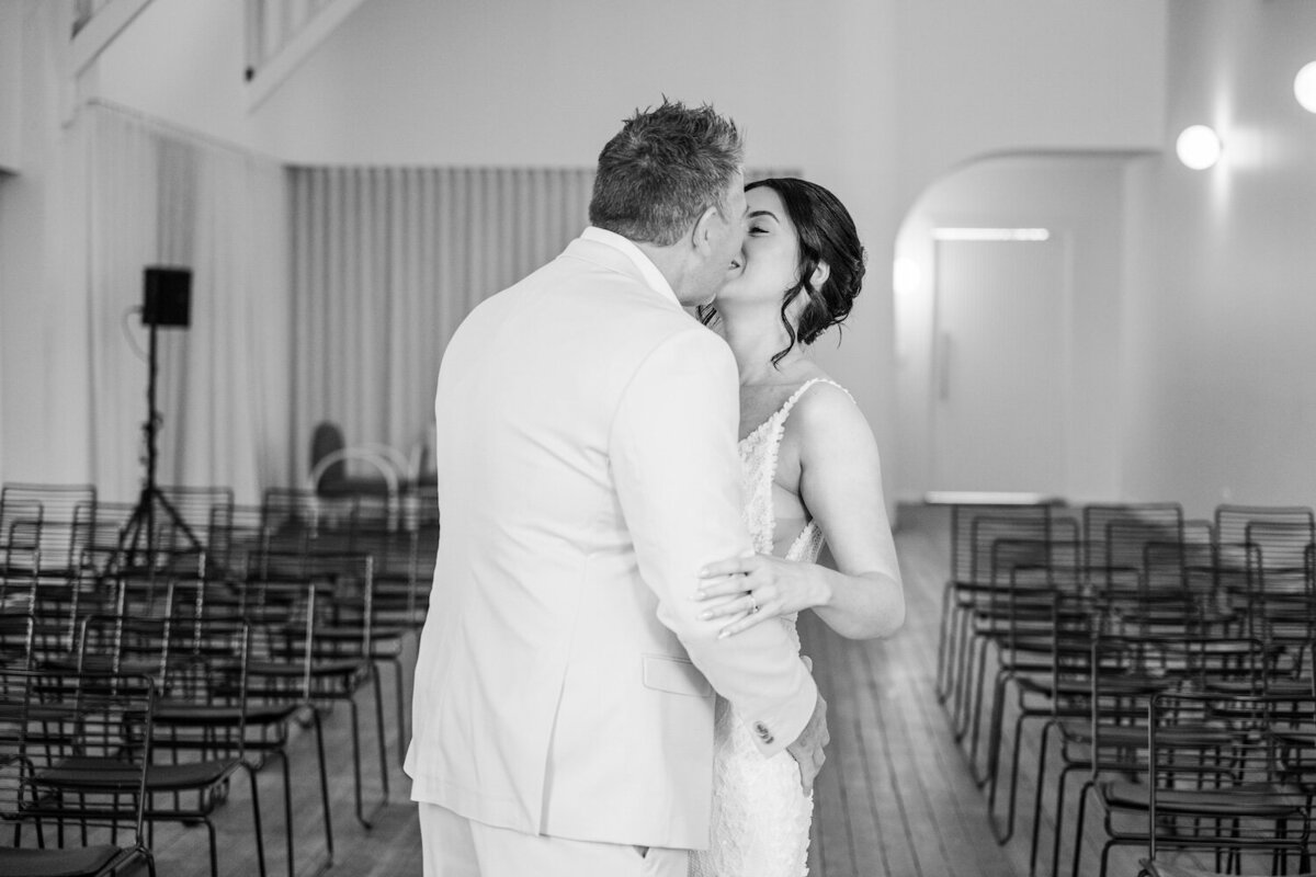 Bride and Groom sharing a kiss at a first look