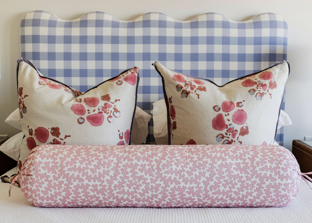 oyster creek studios lighthouse on the lake blue gingham bed frame with floral pillows in bedroom