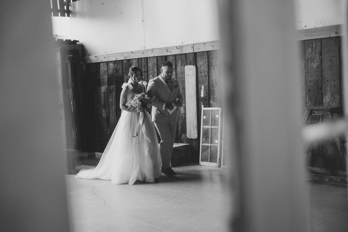 Hanna being walked to the ceremony by her brother