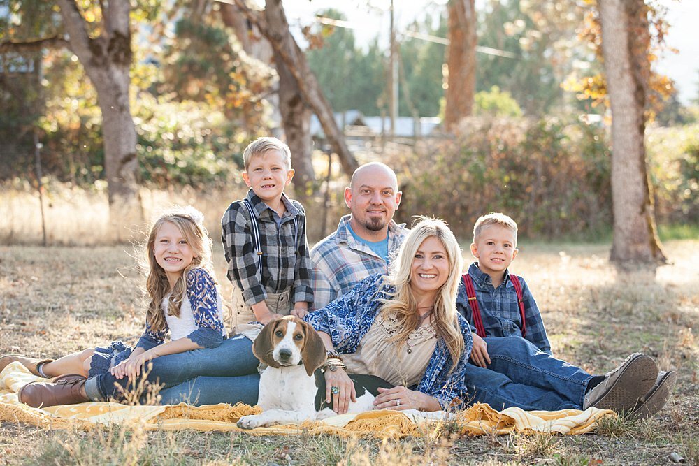 Oregon family sitting on blanket with dog