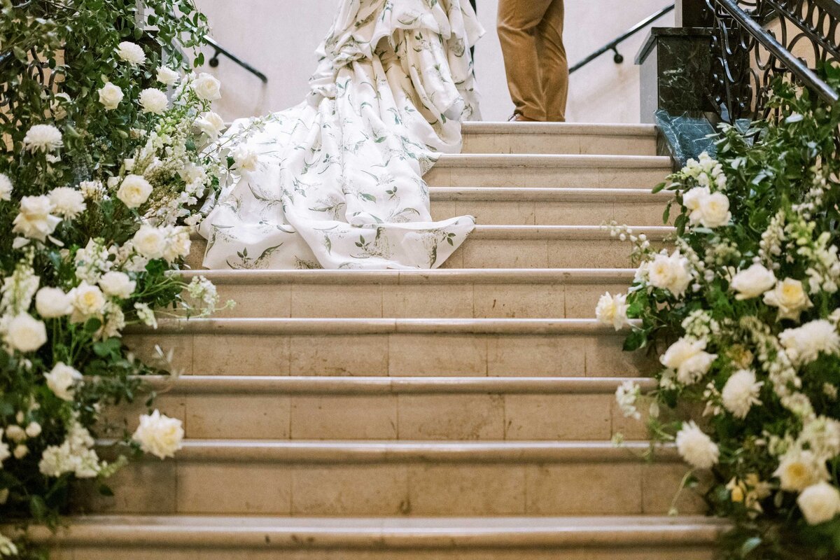 dress-flowing-down-stairs-during-ceremony