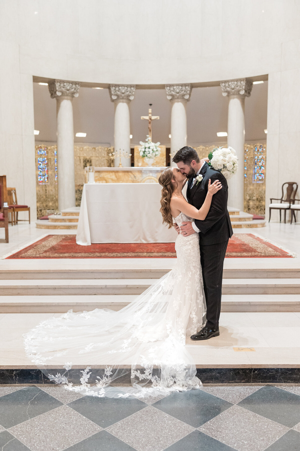 a bride and groom share their first kiss as husband and wife