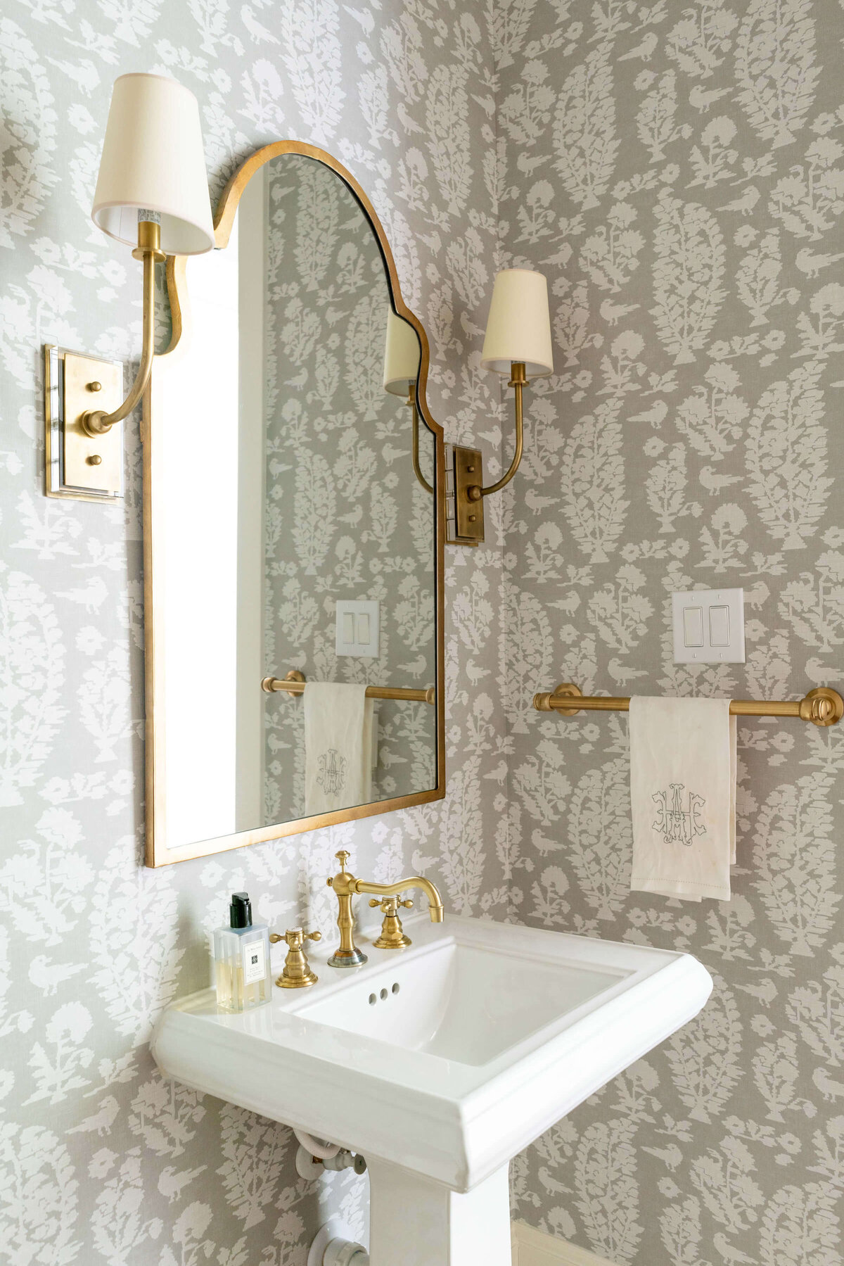 oyster creek studios heathcott taupe floral wallpaper pattern in bathroom with gold accents