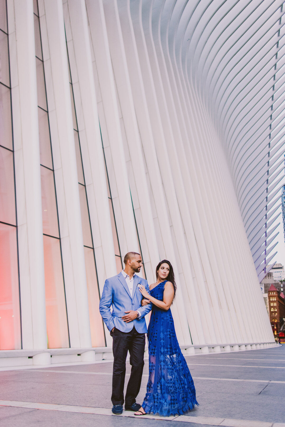 A couple standing in front of the oculus in nyc
