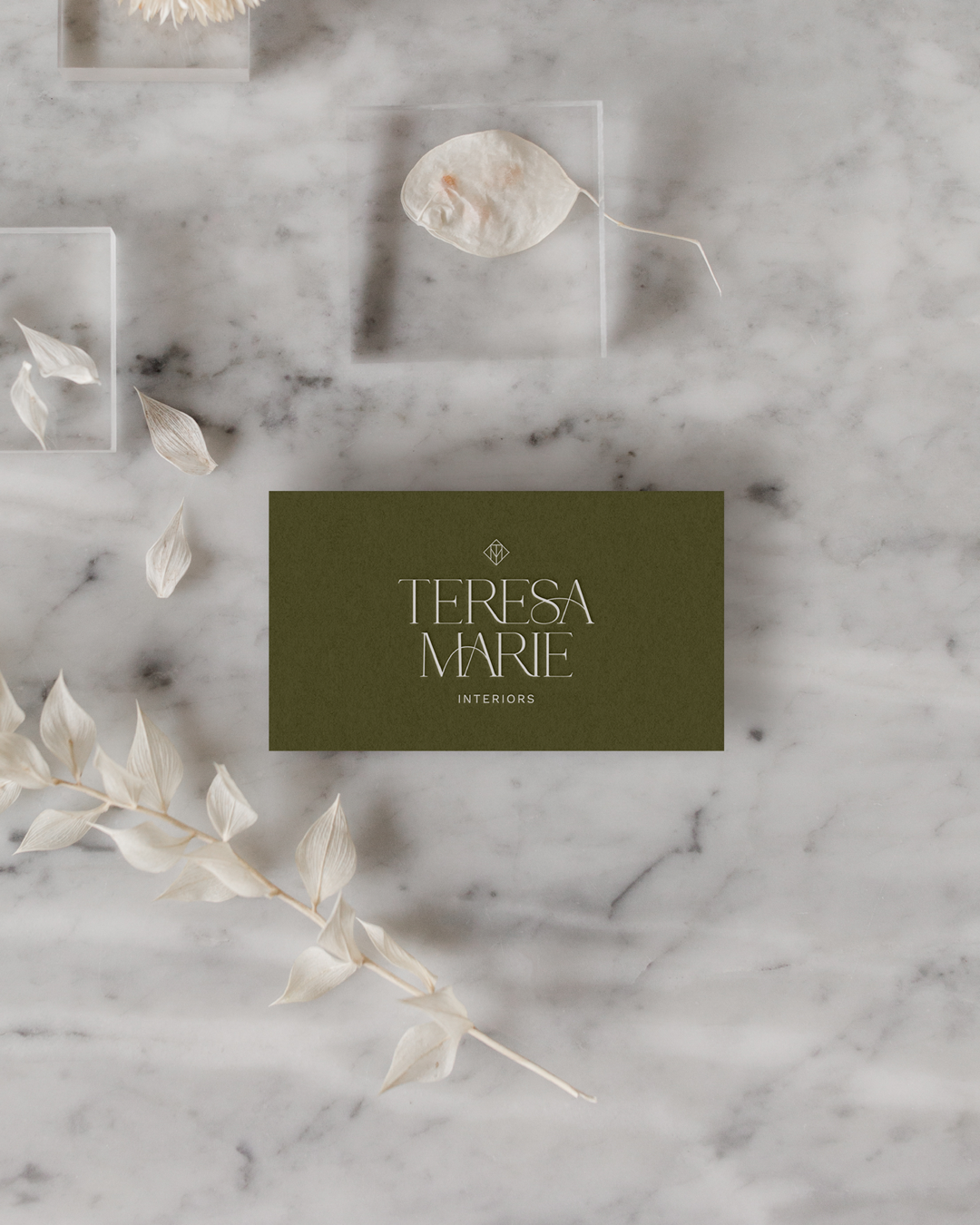 boutique-style business card for an interior design business, combining warmth and sophistication