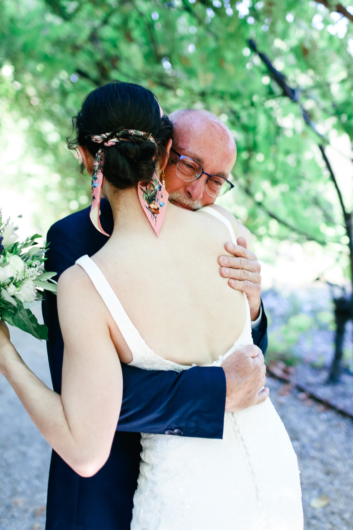 father-hugs-bride-at-luxury-wedding-in-gordes