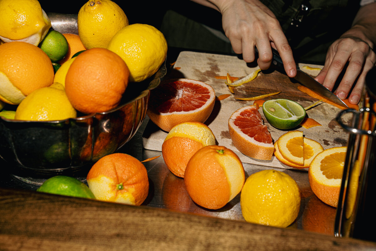 Food Photography in Greenville, SC featuring a person prepping fruit for garnishes