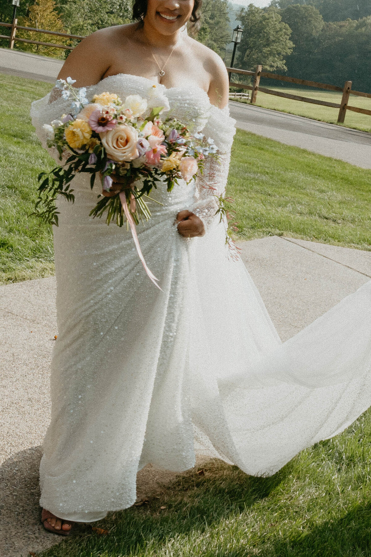 Bride holding bouquet after luxury wedding ceremony