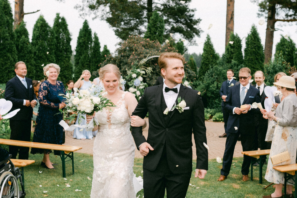 The wedding couple leaving the ceremony photographed by wedding photographer Hannika Gabrielsson.