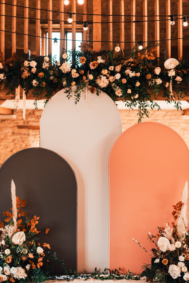 boho arches with earthy tones, perfect as a wedding ceremony backdrop