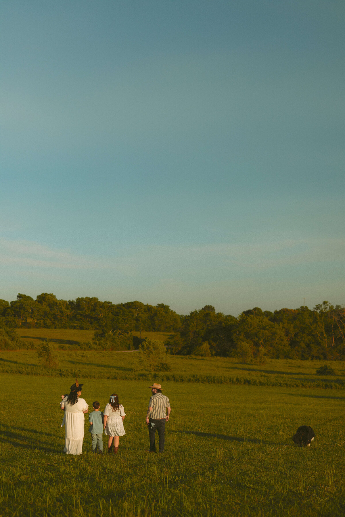 Parents embracing children during candid family photography in Nashville TN