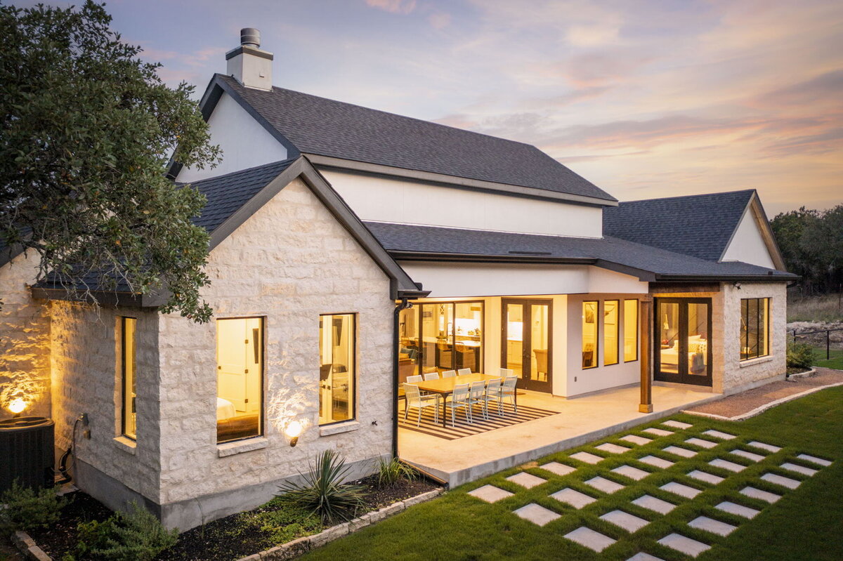 aerial view of back porch with concrete pavers in grass