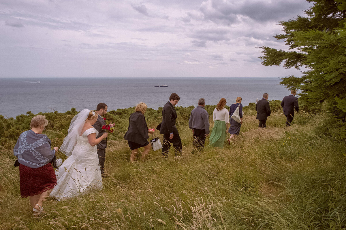 195 wedding-guests-trekking-through-field-howth