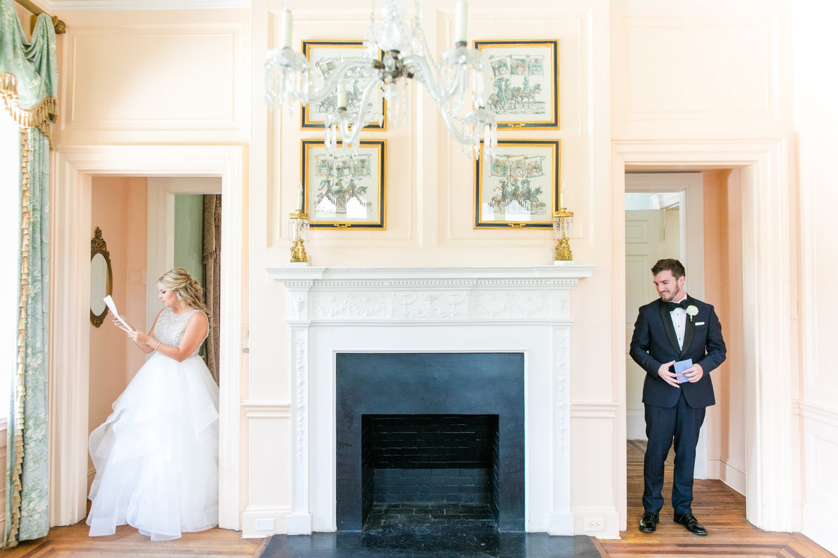 bride and groom read letters to each other before their lowndes grove wedding