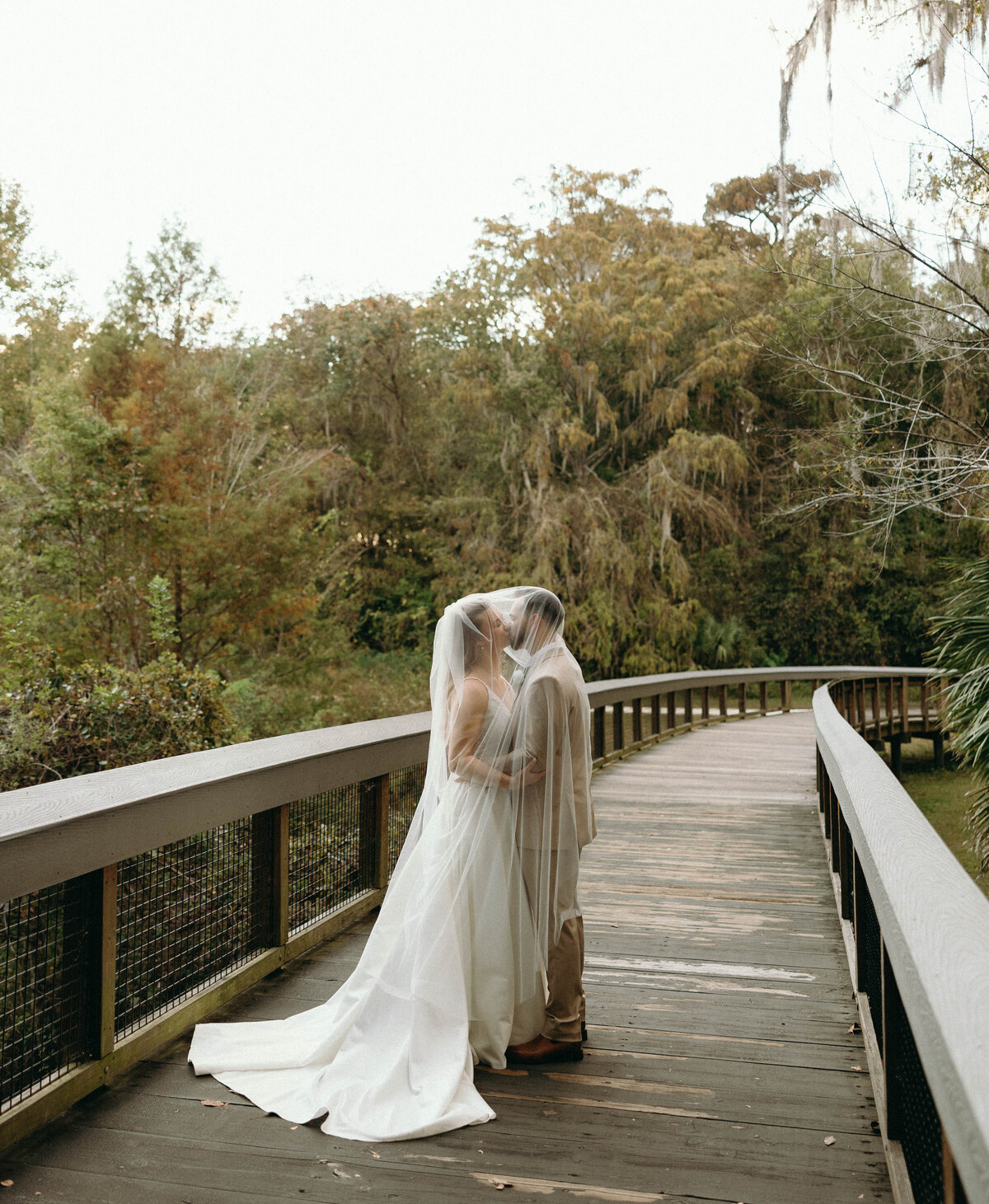 Bride and Groom portraits on bridge at Silver Springs National Park in Ocala, Florida