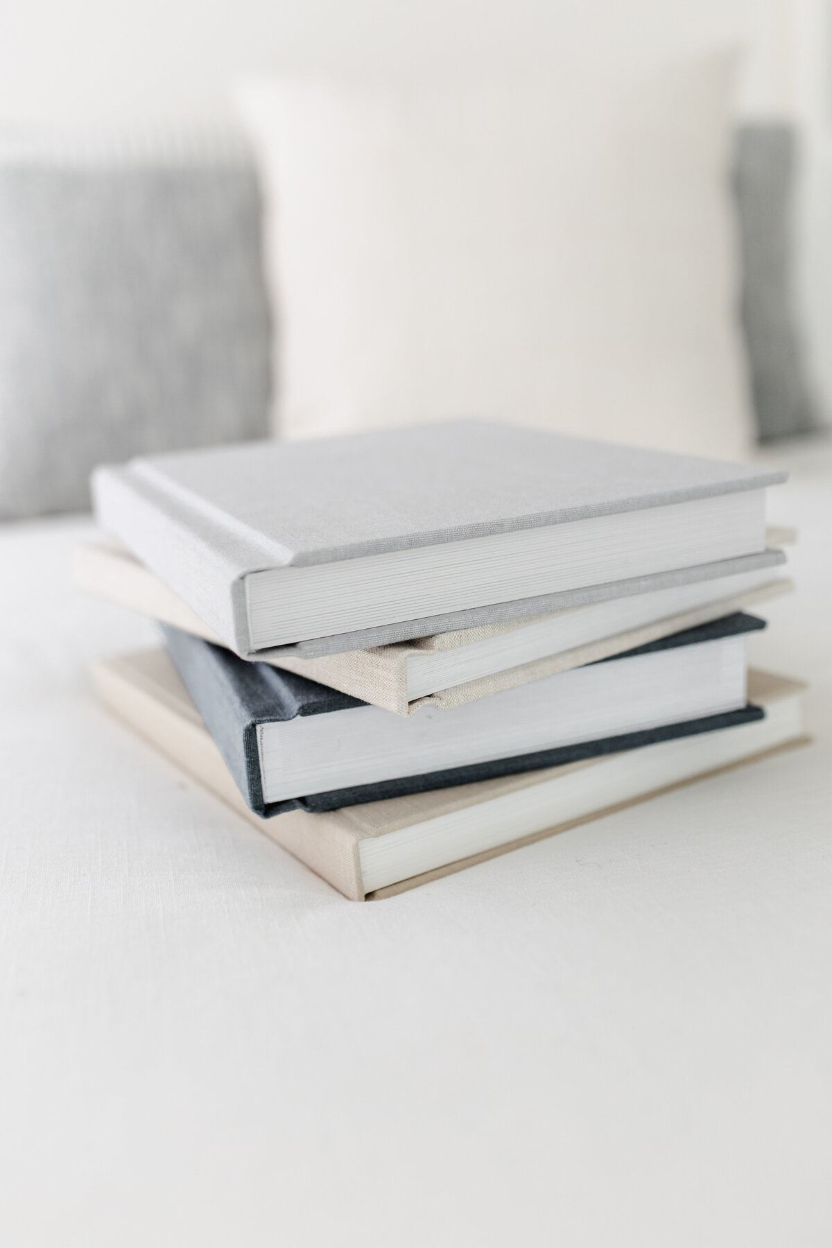 Stack of linen-covered family photo albums