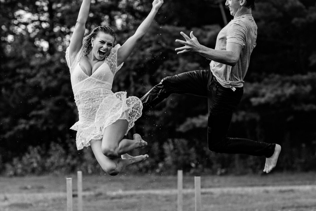 Fun-Engagement-Photos-Jumping-Dock-Water-Wisconsin