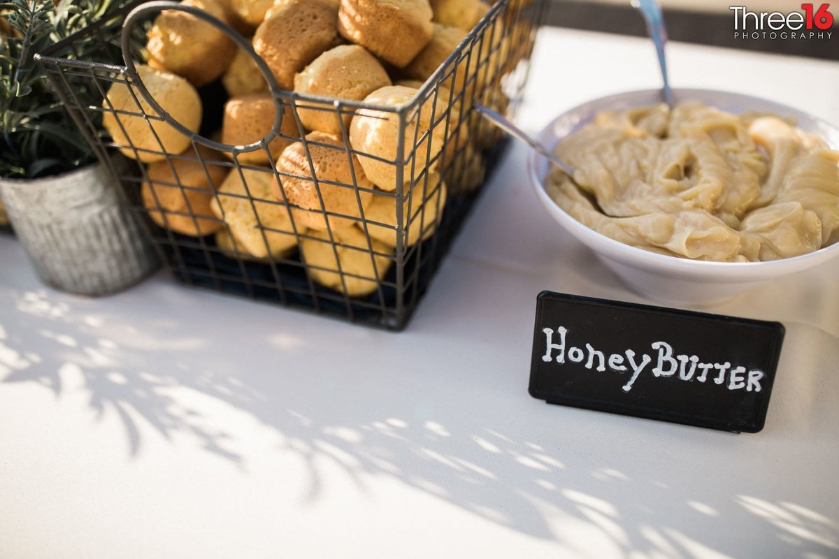 Rolls and Honey Butter being served buffet style at wedding reception