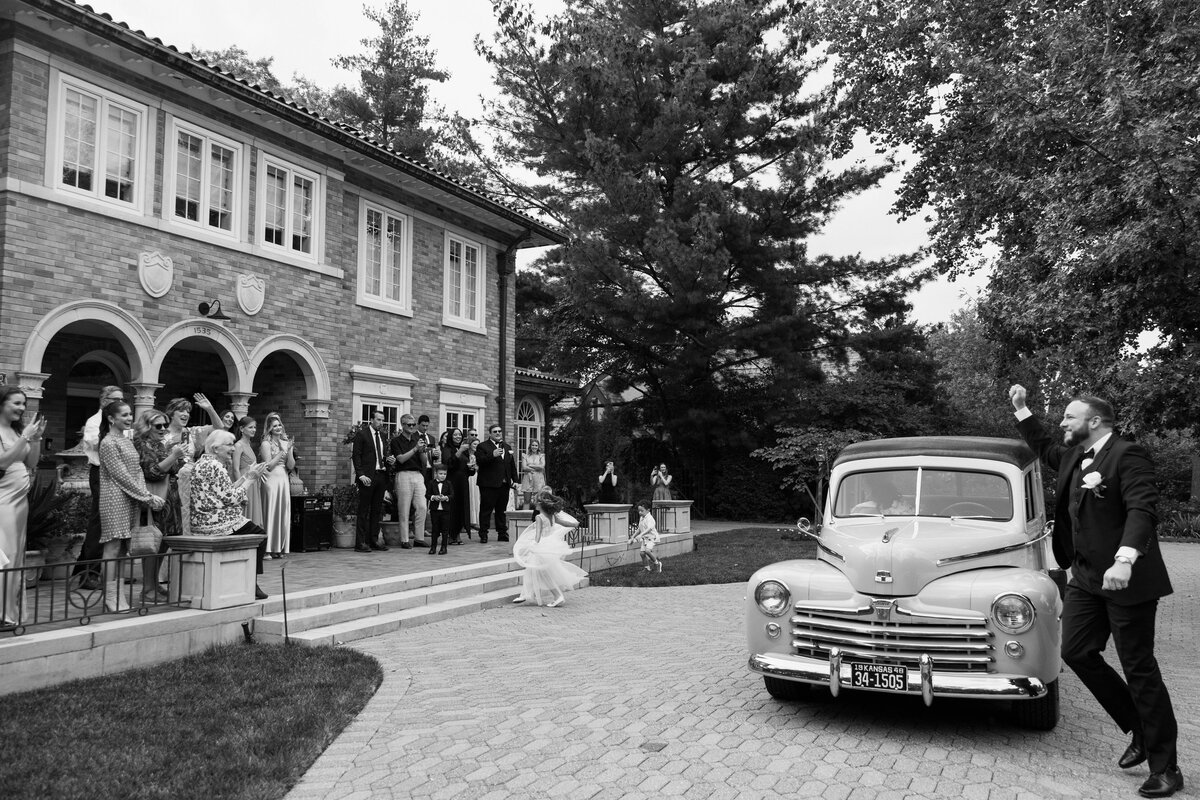 bride and groom after wedding ceremony at nelson atkins museum for wedding party and couples photos with their documentary wedding photograher
