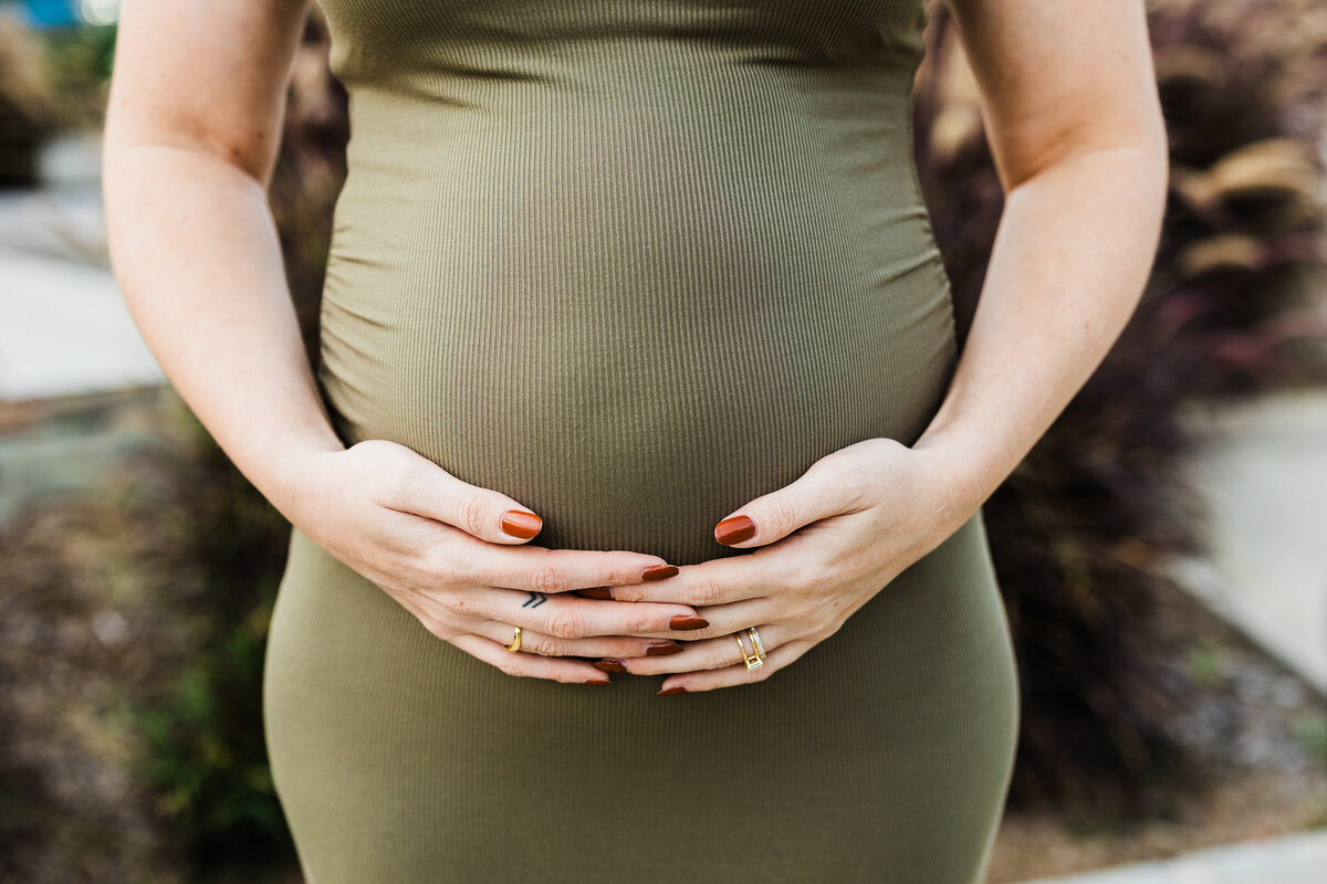 woman-embracing-pregnant-belly