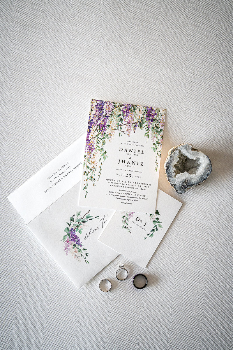 A beautifully styled layflat of the couple's wedding rings and elegant stationery captured at the AC Hotel Pleasanton. The perfect detail shot highlighting sophistication and modern wedding vibes in Northern California.