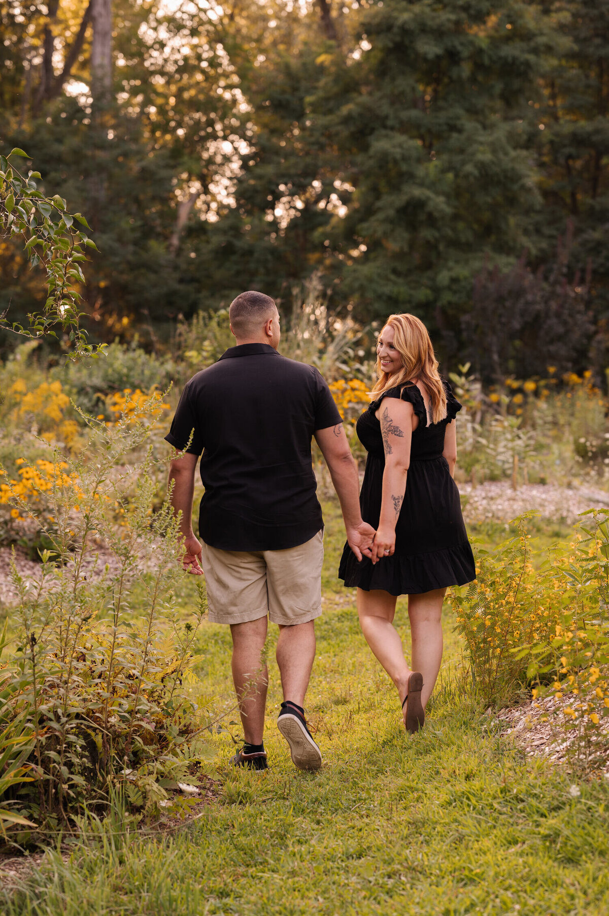 Strolling through the grounds of Hudson Crossing Park for engagement photos in Schuylerville, NY.