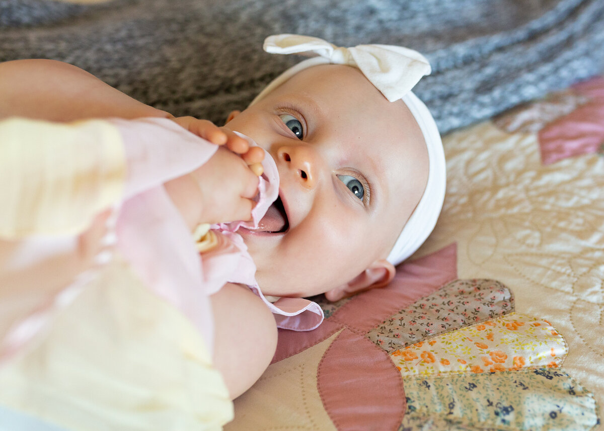 Baby girl smiling at camera