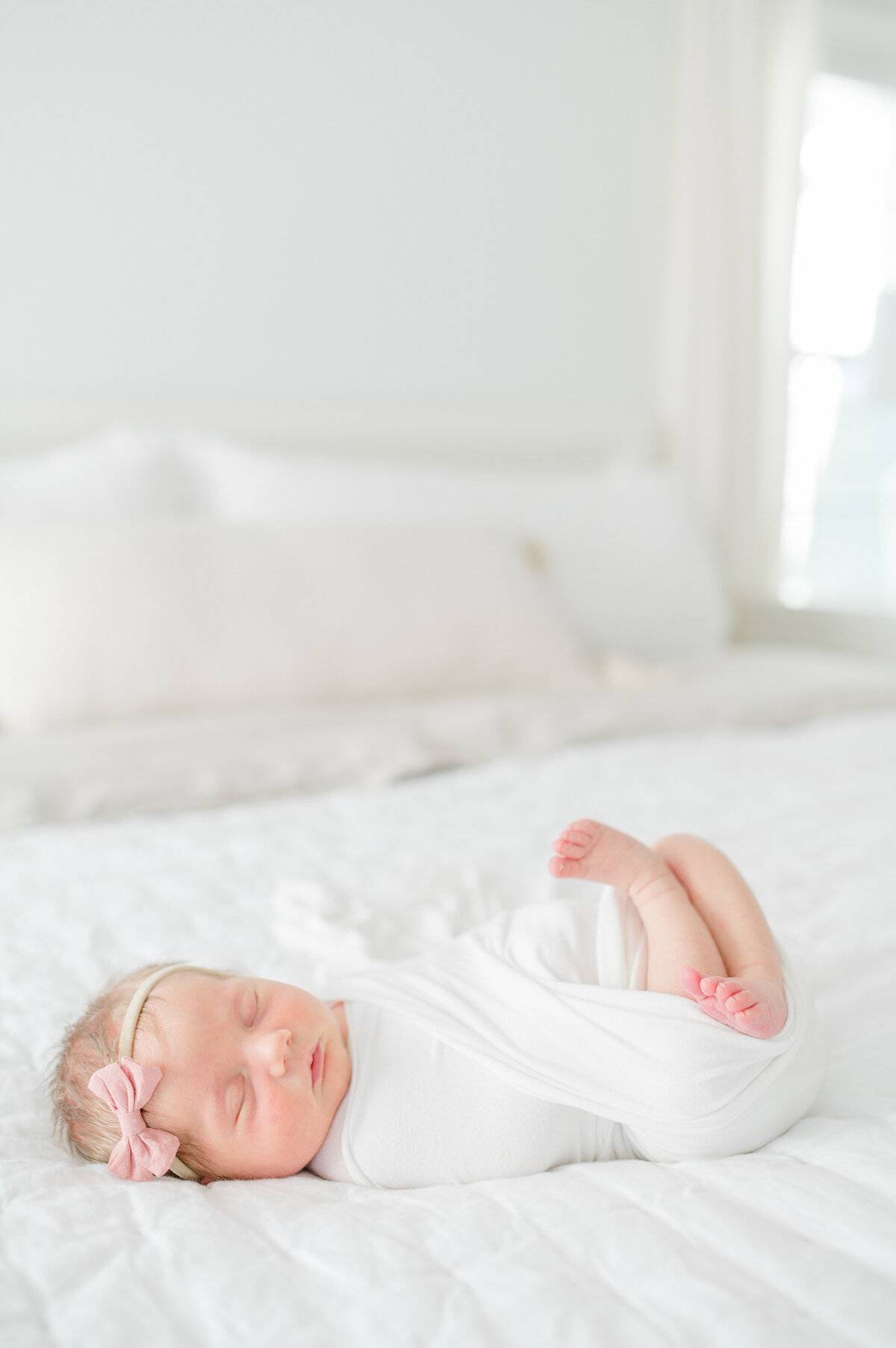 baby-girl-swaddled-on-bed