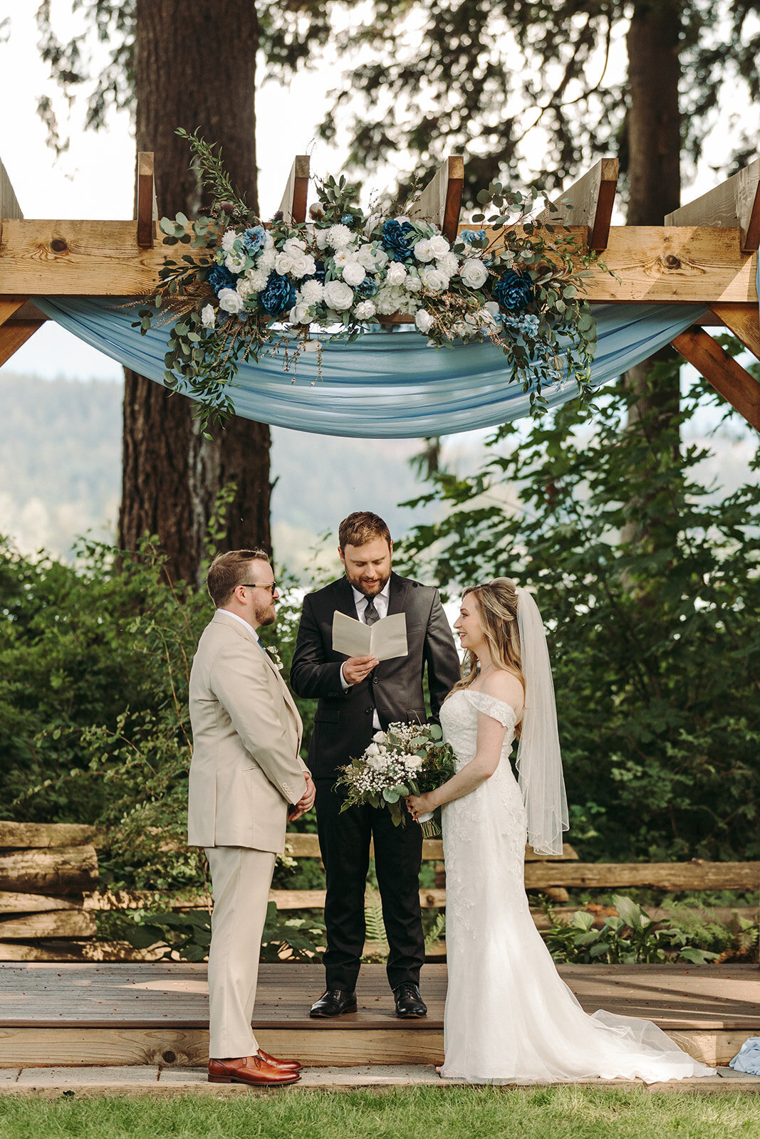 Utah Wedding Photography capturing bride and groom standing at alter together during Spring wedding