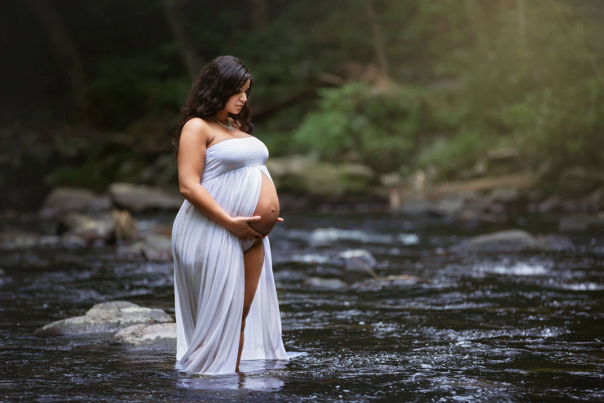 Expecting mom standing in river