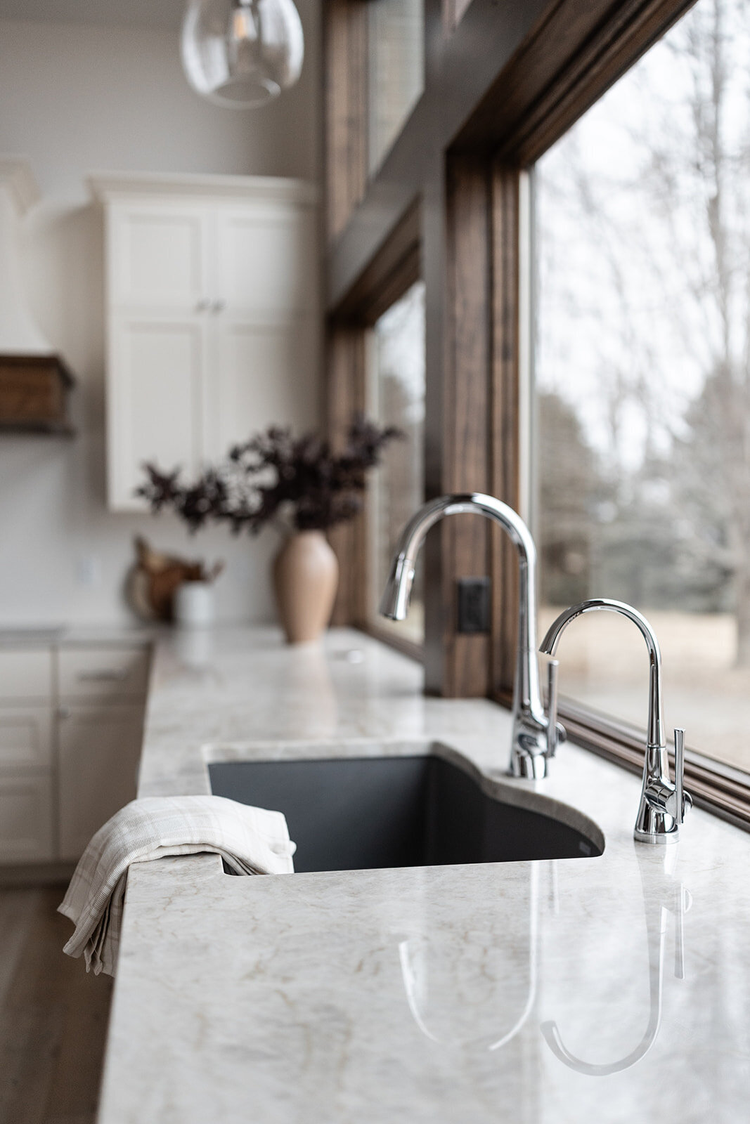 michele rosenboom design clean country renovation large farmhouse kitchen sink with silver faucet