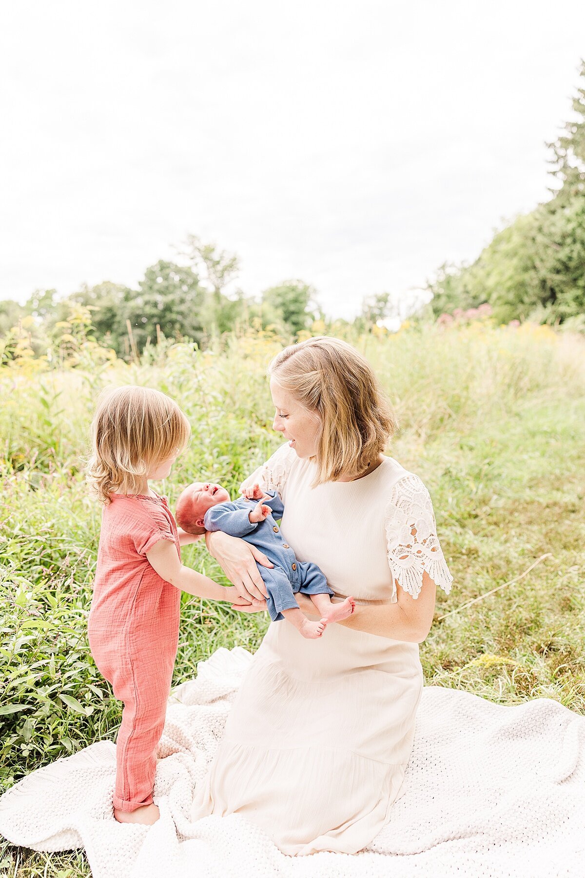 Outside  Newborn Photo Session with Sara Sniderman Photography  at Heard Farm Conservation Land, Wayland Massachusetts