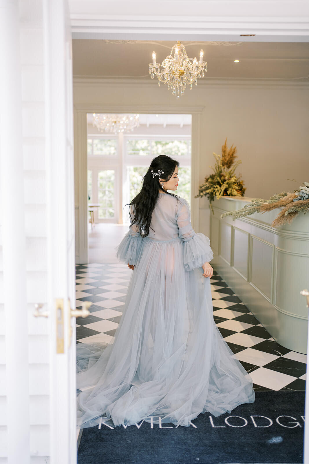 Embrace the beauty of pregnancy as a mum in a blue tulle gown captures stunning maternity moments at Gold Coast's Kwila Lodge.
