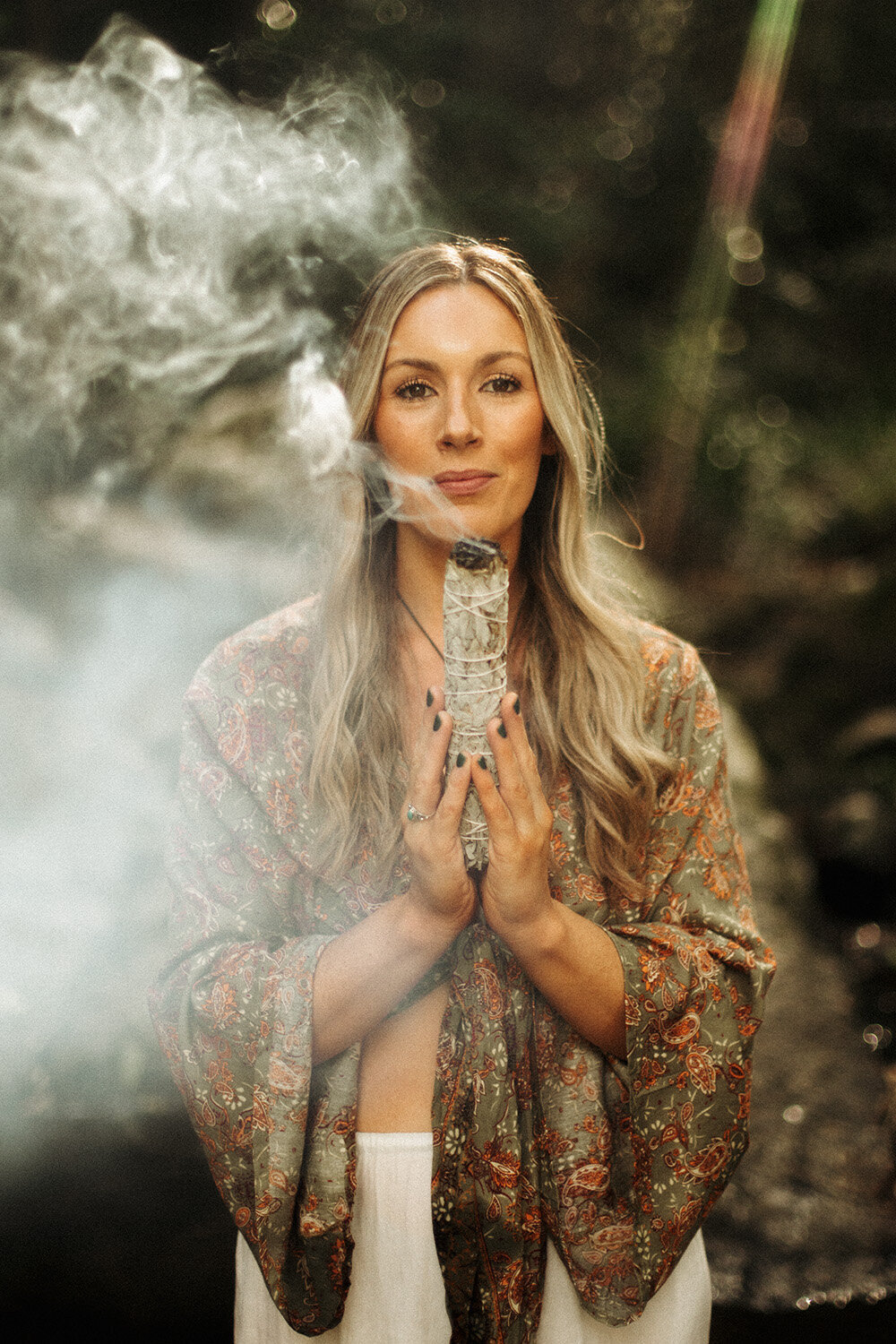 Wellness product photography showcasing handcrafted smudge stick, natural textures and earthy tones
