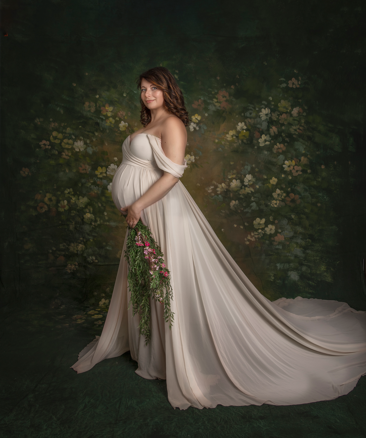"Expecting mom in a stunning cream flowy gown during a maternity photography session in Ottawa studio"