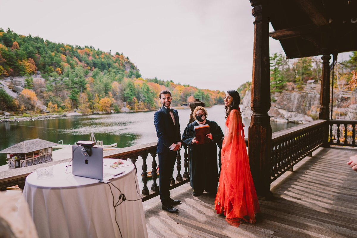 An indian bride and groom laughing during their elopement non-denominational ceremony at mohonk mountain house in new paltz