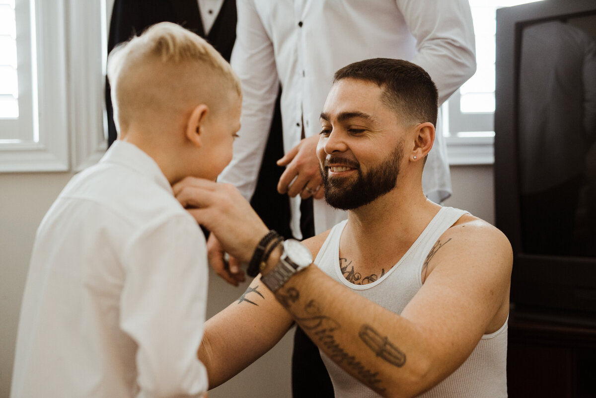 B-markham-home-covid-pandemic-diy-love-is-not-cancelled-wedding-photography-groom-son-getting-ready-04