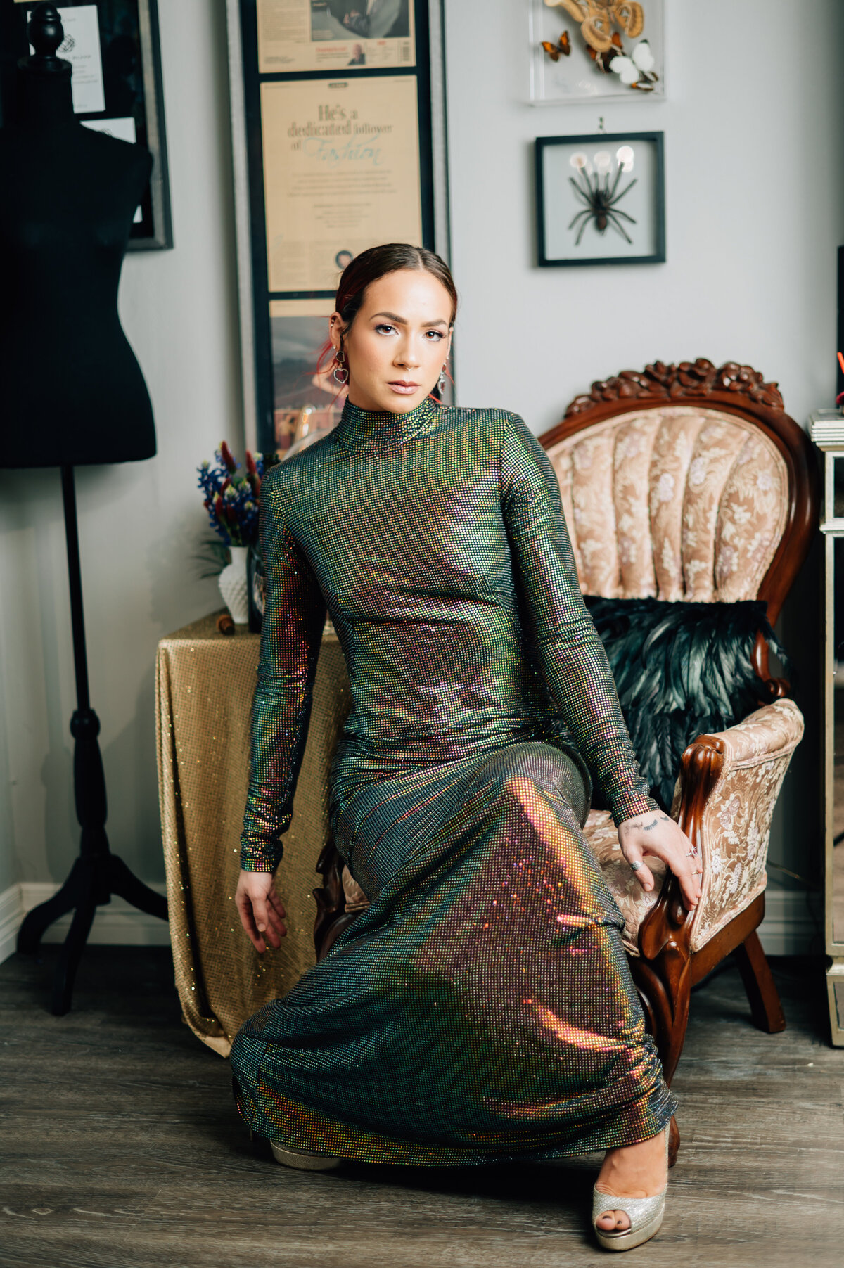 Jonathan Blake seated on ornate velvet chair during Houston editorial shoot