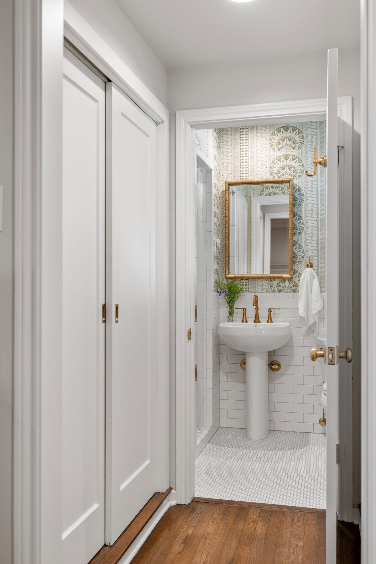 the keeping room interiors oakview half bath with sink and gold framed mirror