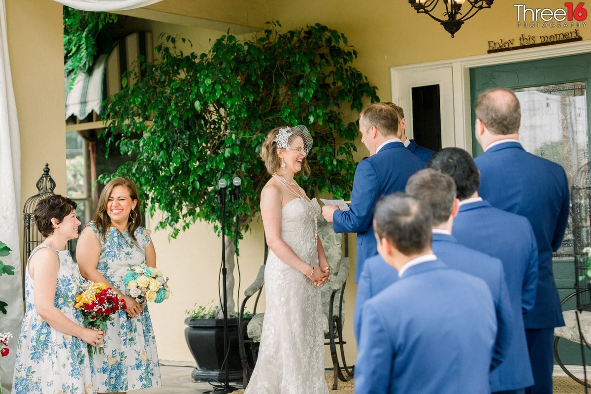 Bride erupts with laughter during Groom's hand written vows
