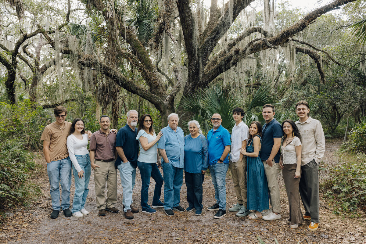 big family poses for family portrait in south florida
