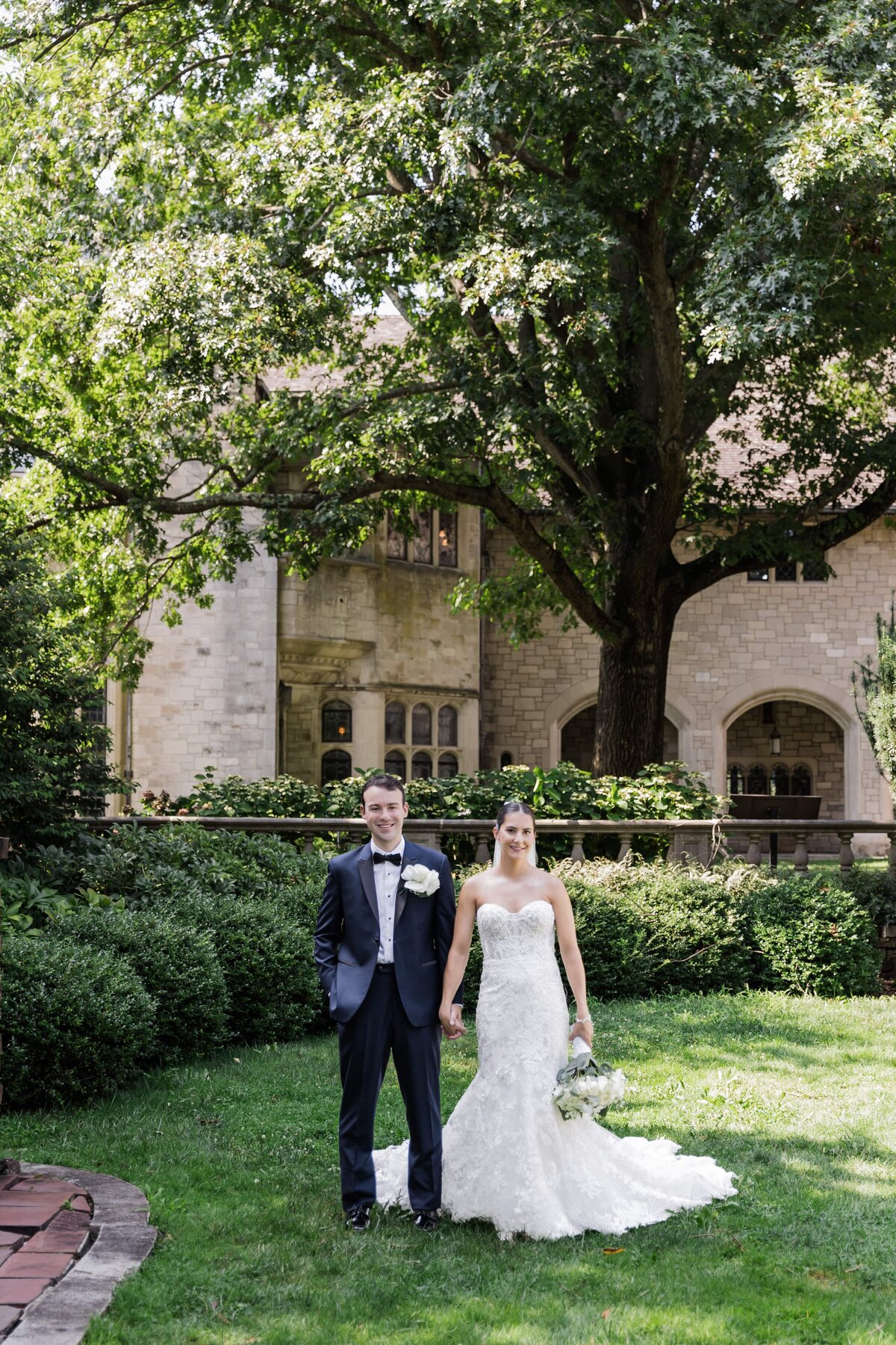 Bride and Groom standing on lawn at Long Island wedding