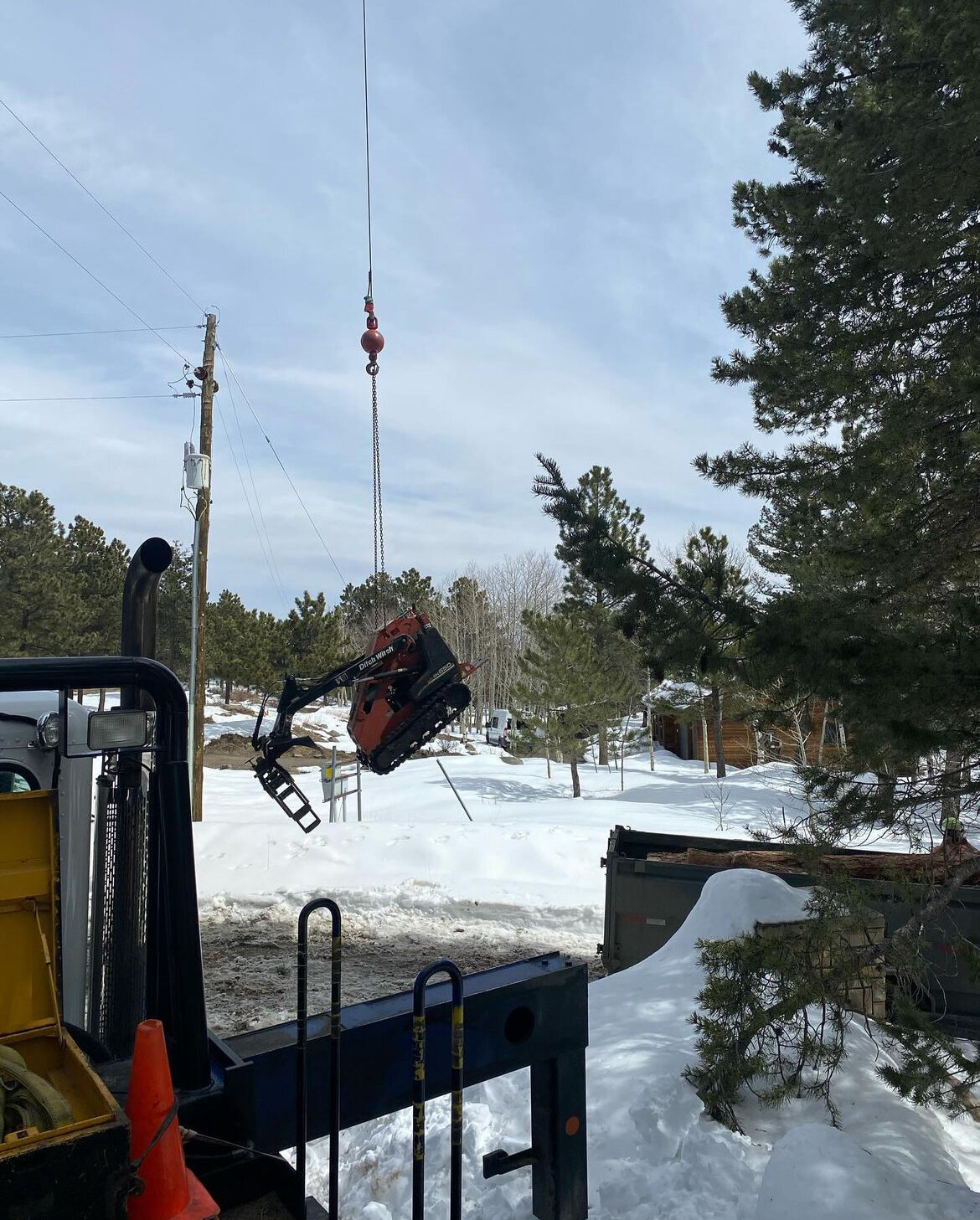 Heavy-equipment transporting by Mountainside Crane Service for Denver Metro and Foothills