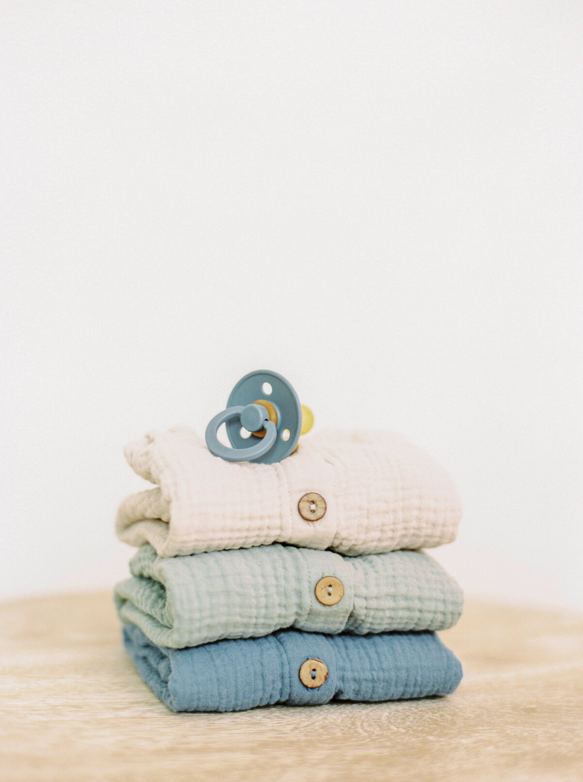 Baby Rompers with Blue Pacifier on Top