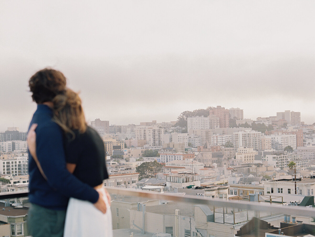 couple looking out at san francisco view