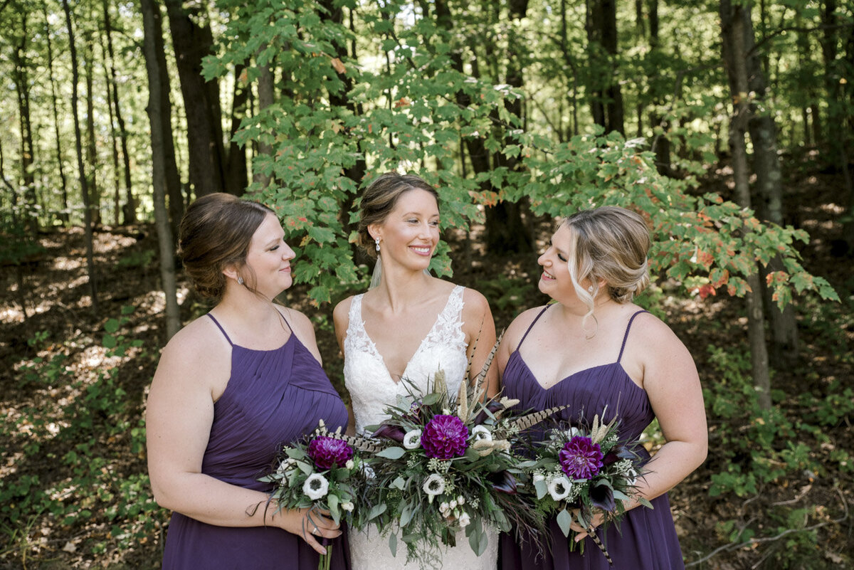 bride with bridesmaids purple and white wedding