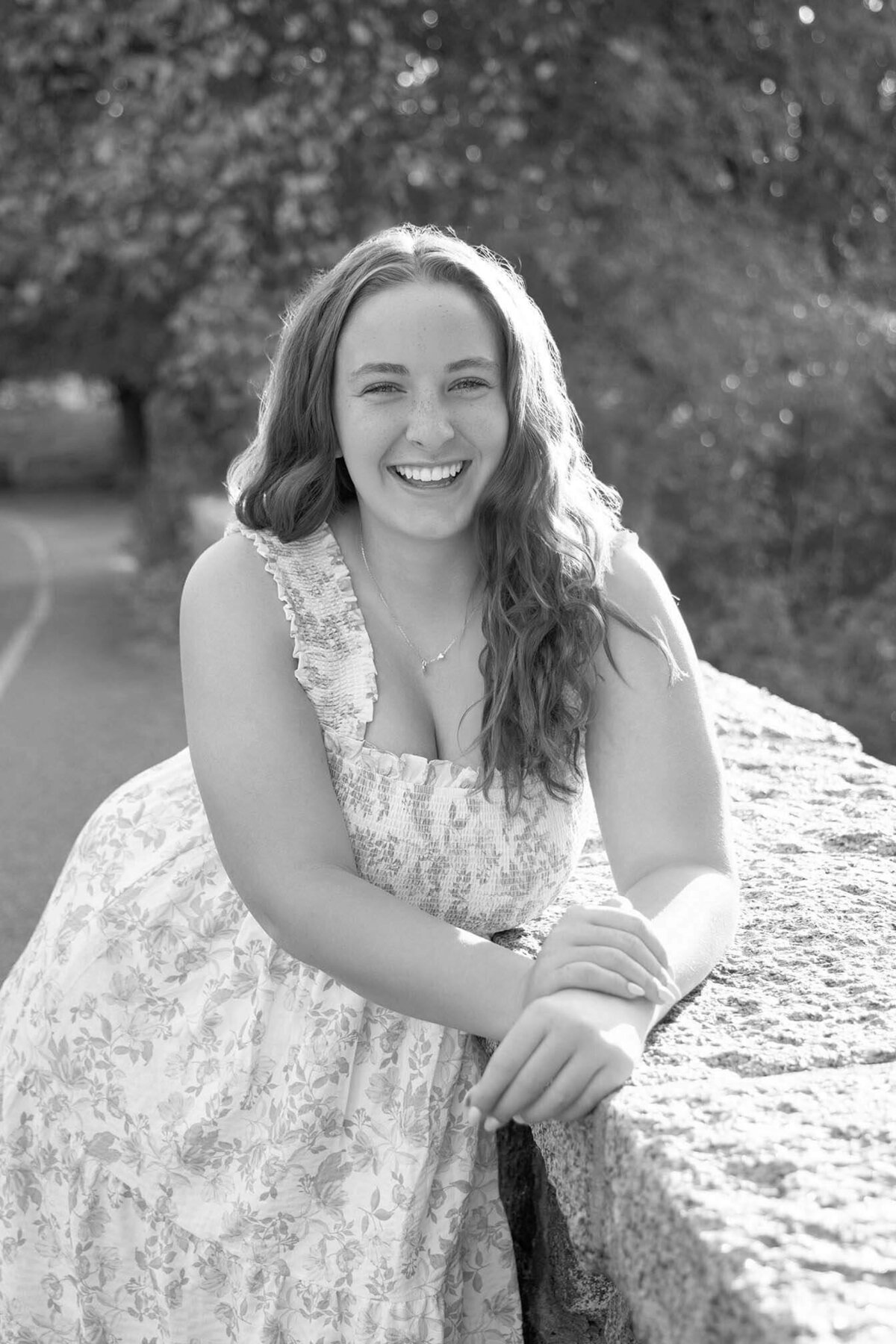 laughing-senior-posed-on-bridge