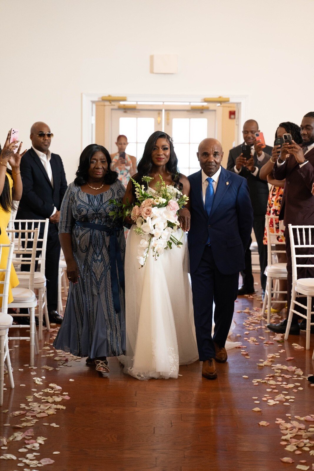 bride-walks-down-aisle-with-parents