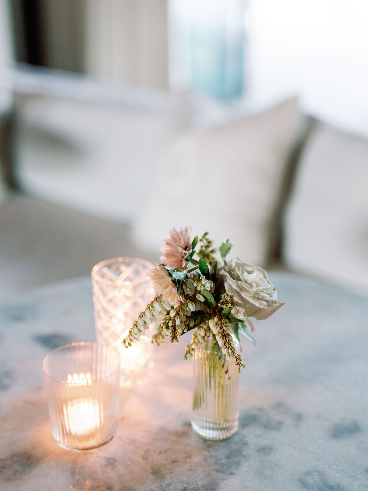 Wedding reception florals in glass vases with elegant design in hues of white, cream, blush, and natural greens. Garden inspired floral design for fall wedding in Tennessee. Lush fall florals featuring roses, dahlias, zinnias, smokebush, and natural greenery. Destination floral design for whimsical and romantic weddings. Design by Rosemary & Finch Floral Design in Nashville, TN.