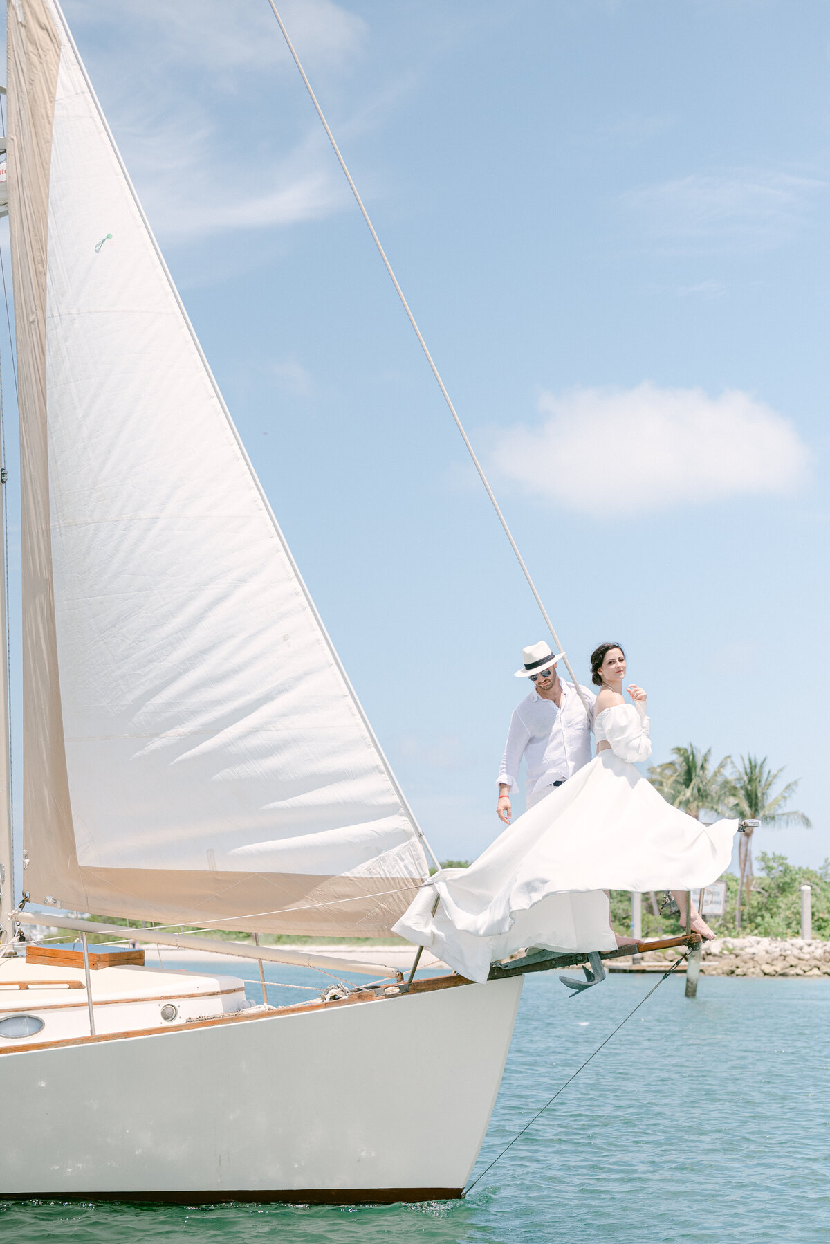 Bride and groom on a sailboat